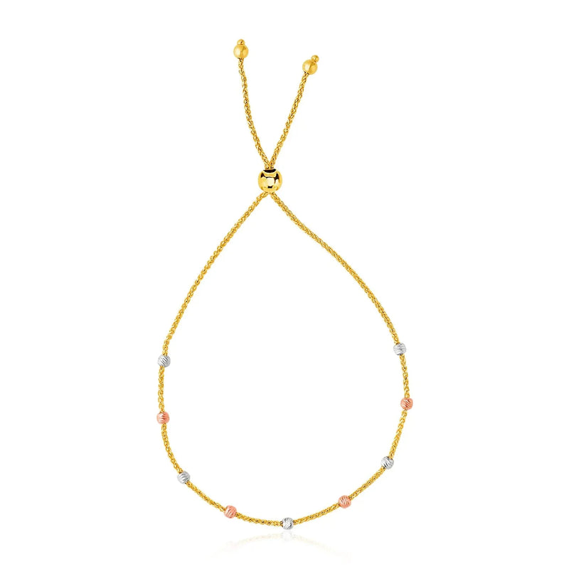 An image displaying 14k Tri-Color Gold Textured Bead Station Lariat Bracelet by Orca Market