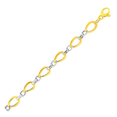 An image displaying Twisted Oval Chain Bracelet in 14k Two Tone Gold by Orca Market