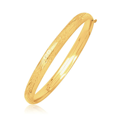 An image displaying 14k Yellow Gold Dome Motif Children's Bangle with Diamond Cuts by Orca Market