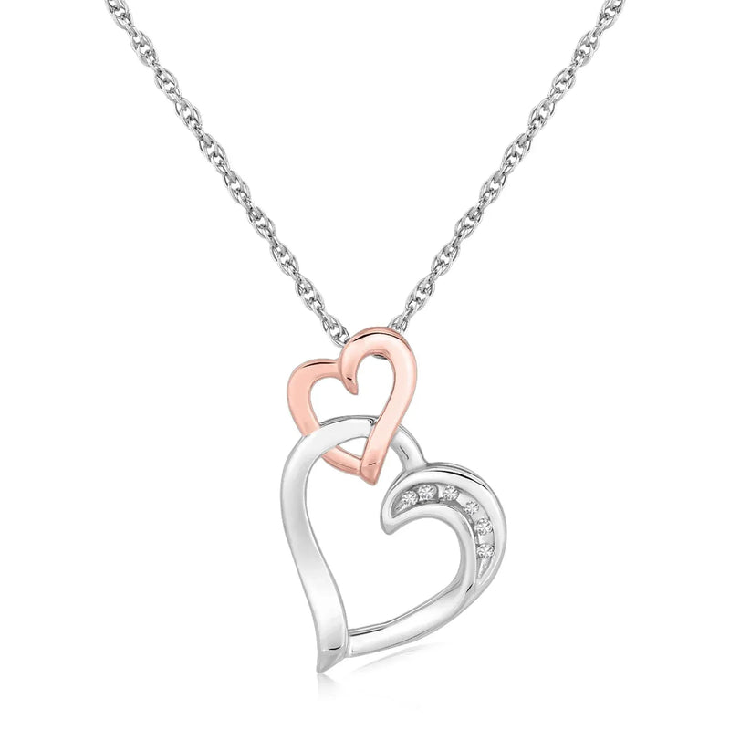 An image displaying Sterling Silver Cascading Dual Heart Diamond Accented Pendant (.02 cttw) by Orca Market
