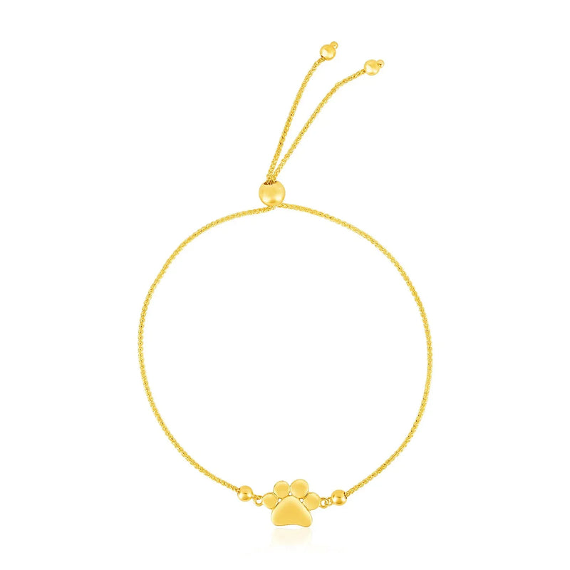 An image displaying 14k Yellow Gold Adjustable Paw Print Bracelet by Orca Market