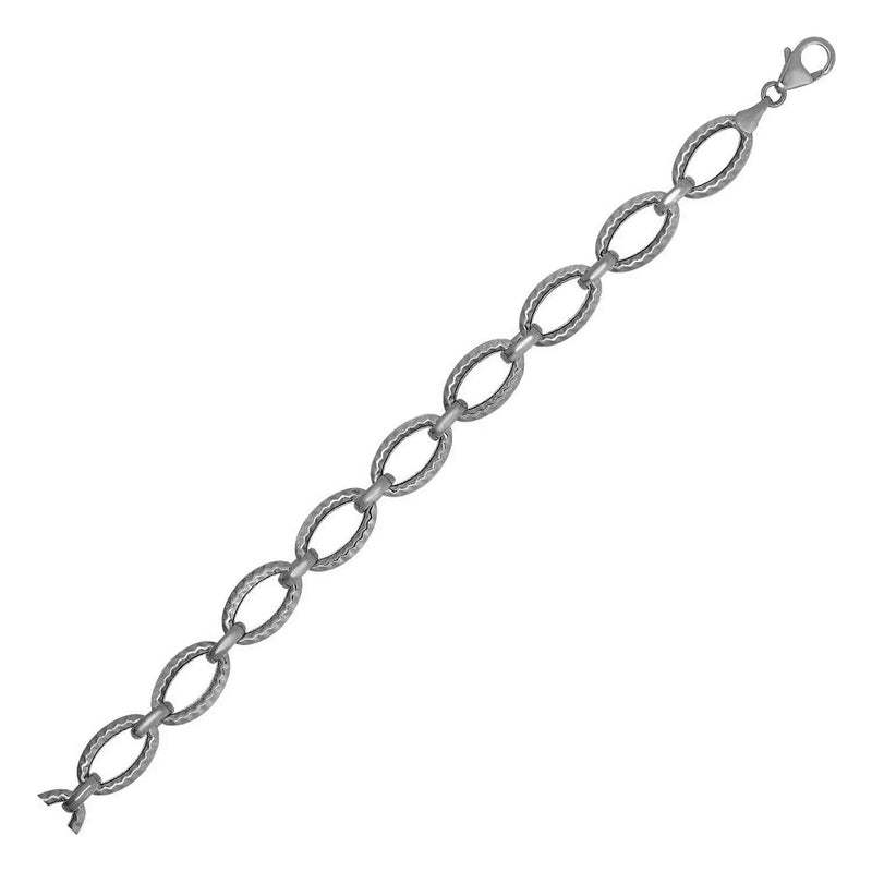 An image displaying Textured Oval Link Bracelet in 14k White Gold by Orca Market