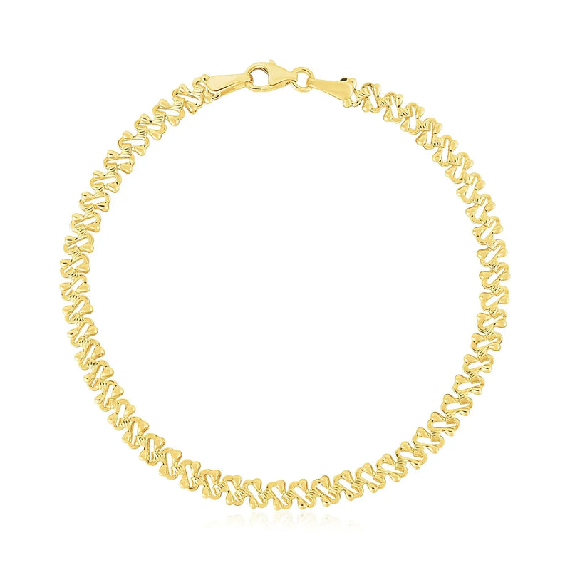 An image displaying 14k Yellow Gold High Polish Textured Fancy Chain Bracelet (4mm) by Orca Market