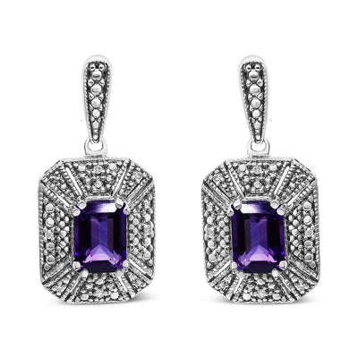 An image displaying .925 Sterling Silver Diamond Accent and 7x5mm Purple Amethyst Stud Earrings (I-J Color, I2-I3 Clarity) by Infinite Jewels