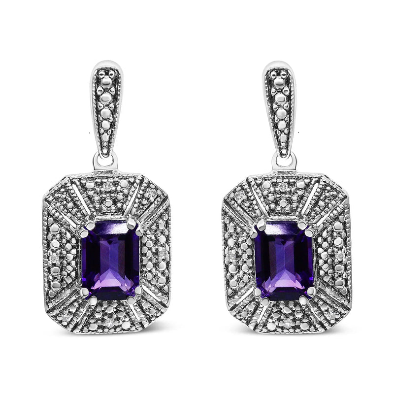An image displaying .925 Sterling Silver Diamond Accent and 7x5mm Purple Amethyst Stud Earrings (I-J Color, I2-I3 Clarity) by Infinite Jewels
