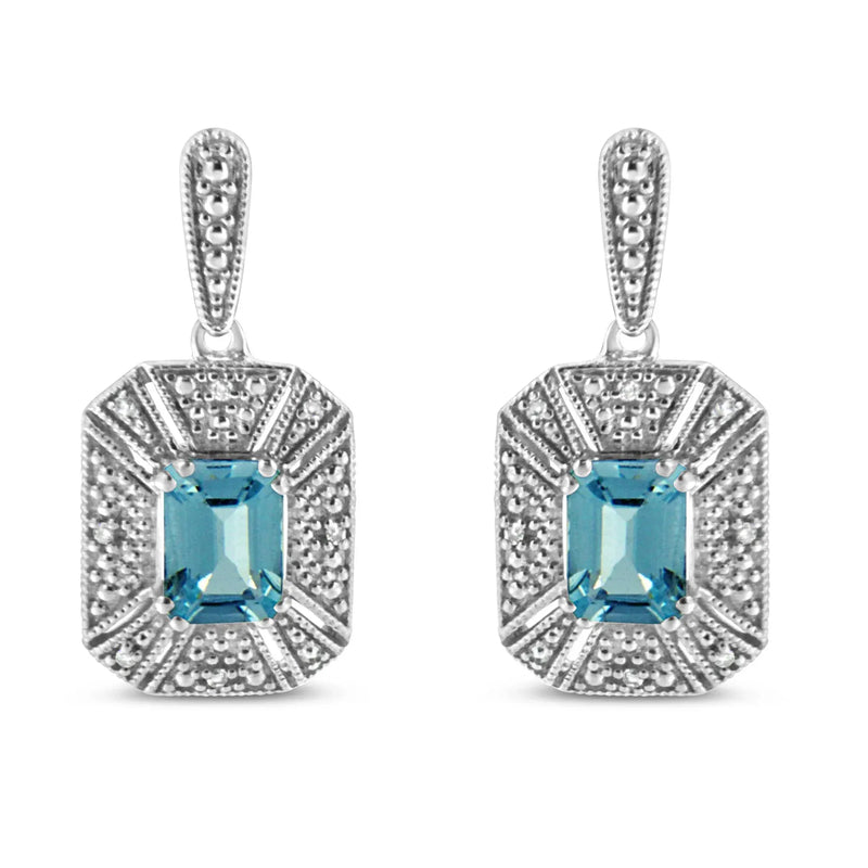 An image displaying .925 Sterling Silver 7x5MM Emerald Shape Blue Topaz and Diamond Accent Art Deco Halo Style Drop and Dangle Earrings (I-J Color, I1-I2 Clarity) by Infinite Jewels