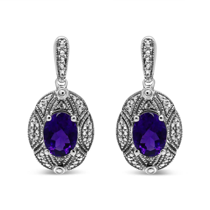 An image displaying .925 Sterling Silver Diamond Accent and 8x6mm Purple Oval Amethyst Stud Earrings (I-J Color, I1-I2 Clarity) by Infinite Jewels