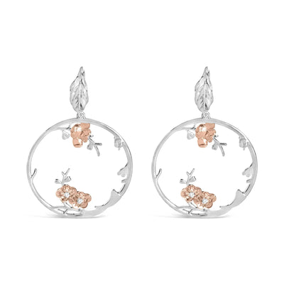 An image displaying Rose Gold Plated .925 Sterling Silver 1/10 Cttw Diamond Floral Hoop Earrings (I-J Color, SI1-SI2 Clarity) by Infinite Jewels