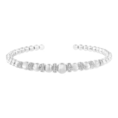 An image displaying .925 Sterling Silver 1/4 Cttw Diamond Rondelle Graduated Ball Bead Cuff Bangle Bracelet (I-J color, I2-I3 clarity) - Fits wrists up to 7 1/2 inches by Infinite Jewels