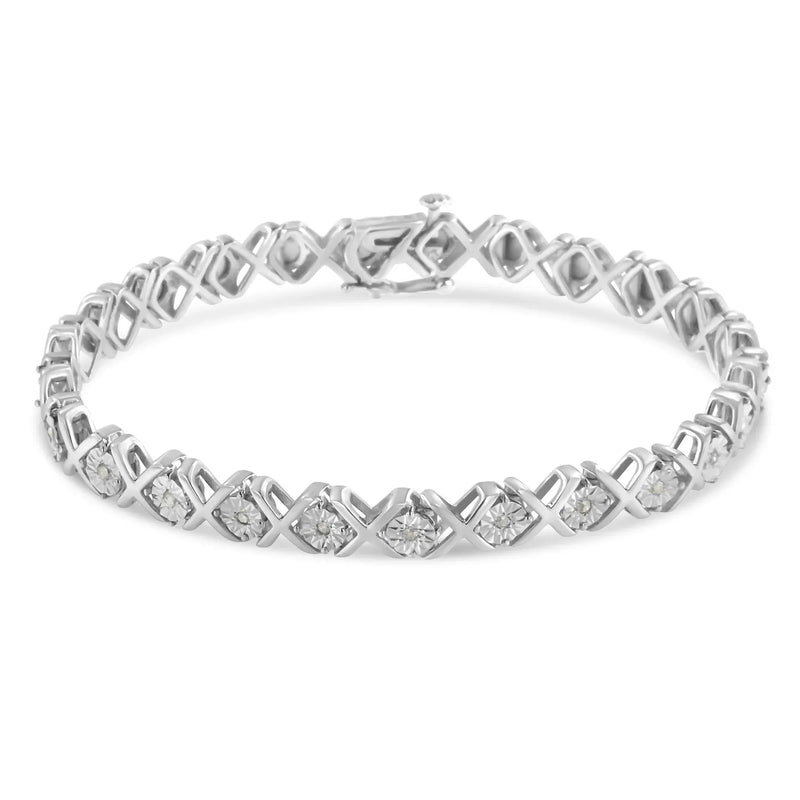 An image displaying .925 Sterling Silver 1/10 cttw Miracle-Set Round-Cut Diamond "X" Link Tennis Bracelet (I-J color, I2-I3 clarity) - 7.25" by Infinite Jewels
