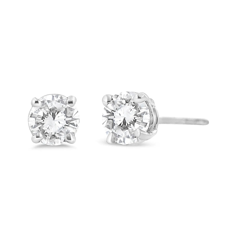 An image displaying 14K White Gold 3/4 Cttw Lab Grown Diamond 4-Prong Classic Stud Earrings (F-G Color, VS2-SI1 Clarity) by Infinite Jewels