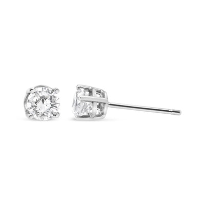 An image displaying 14K White Gold 3/4 Cttw Lab Grown Diamond 4-Prong Classic Stud Earrings (F-G Color, VS2-SI1 Clarity) by Infinite Jewels