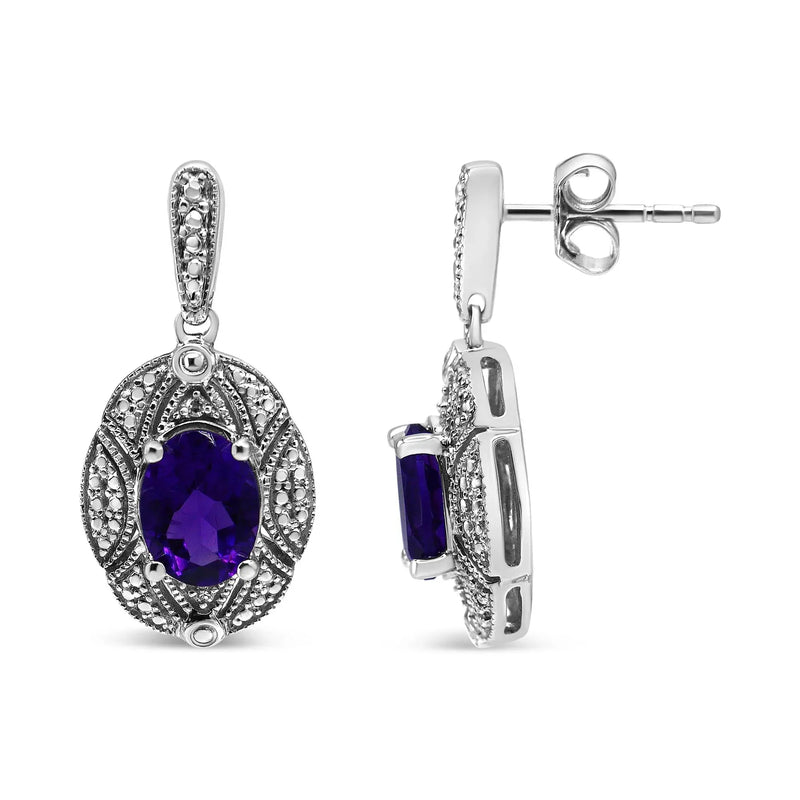 An image displaying .925 Sterling Silver Diamond Accent and 8x6mm Purple Oval Amethyst Stud Earrings (I-J Color, I1-I2 Clarity) by Infinite Jewels