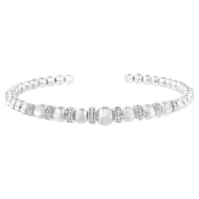 An image displaying .925 Sterling Silver 1/4 Cttw Diamond Rondelle Graduated Ball Bead Cuff Bangle Bracelet (I-J color, I2-I3 clarity) - Fits wrists up to 7 1/2 inches by Infinite Jewels
