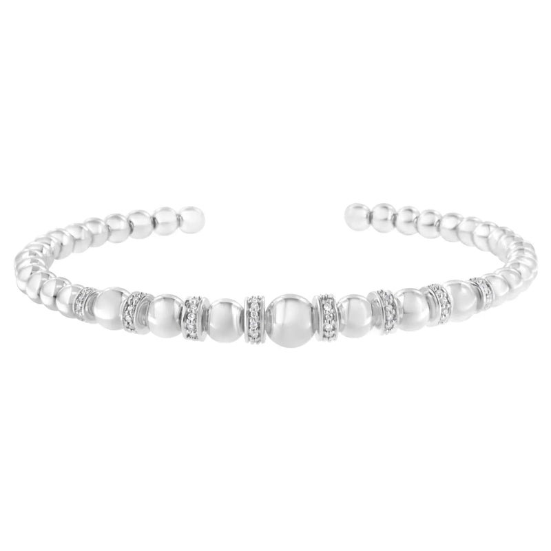 An image displaying .925 Sterling Silver 1/4 Cttw Diamond Rondelle Graduated Ball Bead Cuff Bangle Bracelet (I-J color, I2-I3 clarity) - Fits wrists up to 7 1/2 inches by Infinite Jewels
