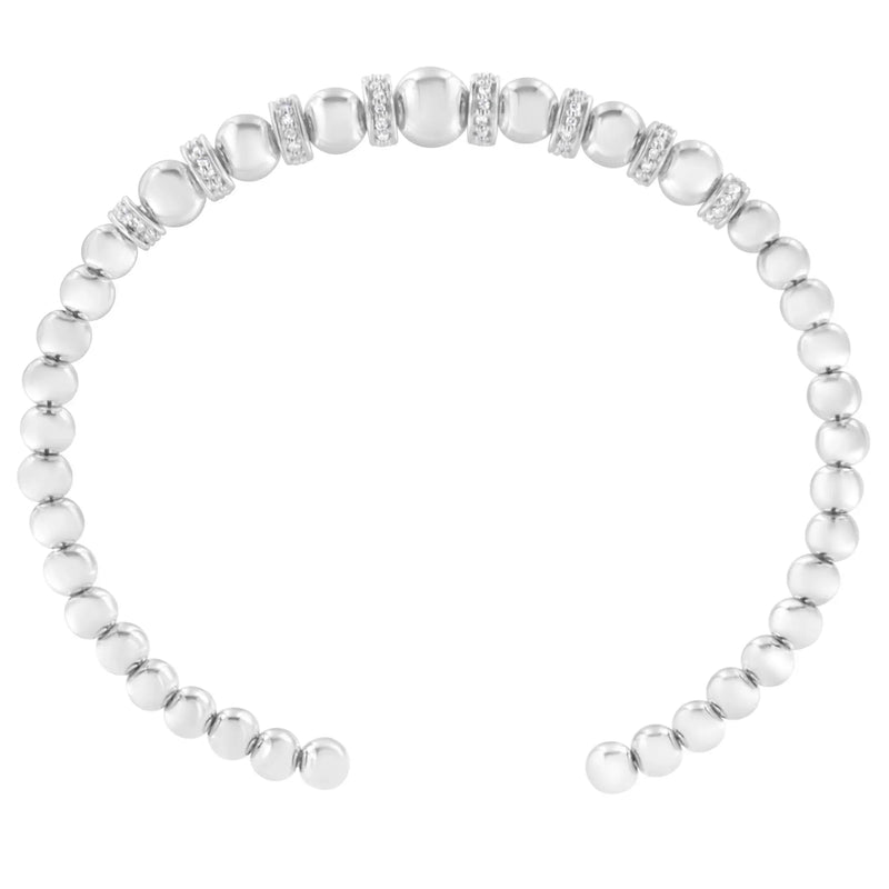 An image displaying .925 Sterling Silver 1/4 Cttw Diamond Rondelle Graduated Ball Bead Cuff Bangle Bracelet (I-J color, I2-I3 clarity) - Fits wrists up to 7 1/2 inches by Infinite Jewels