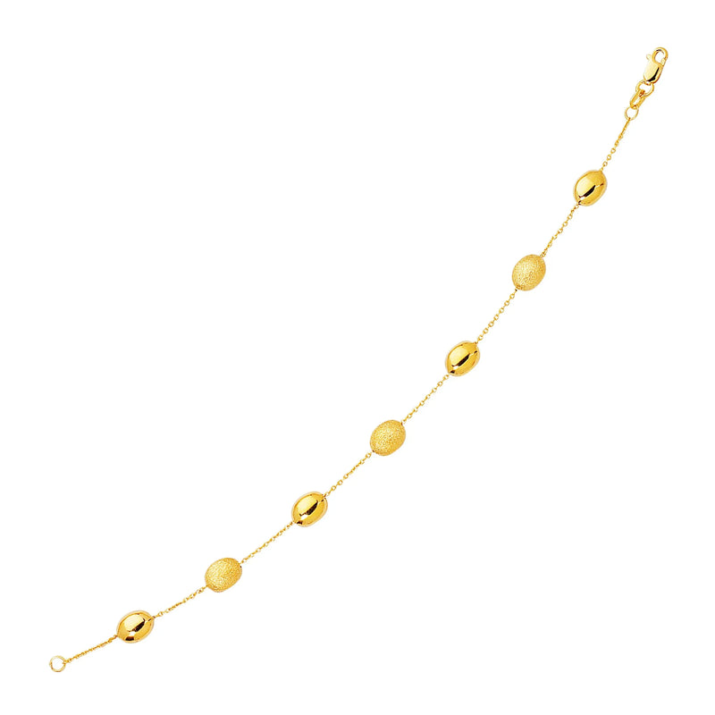 An image displaying 14k Yellow Gold Bracelet with Textured and Polished Pebble Stations by Orca Market