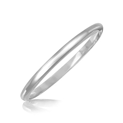 An image displaying Sterling Silver Rhodium Plated Slim Dome Motif Bangle by Orca Market
