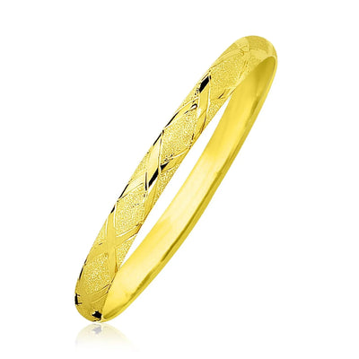 An image displaying 10k Yellow Gold Slender Diamond Pattern Textured Bangle by Orca Market