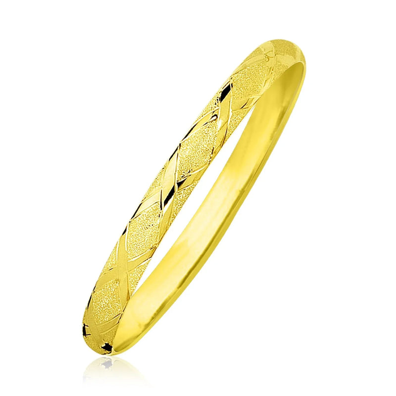 An image displaying 10k Yellow Gold Slender Diamond Pattern Textured Bangle by Orca Market