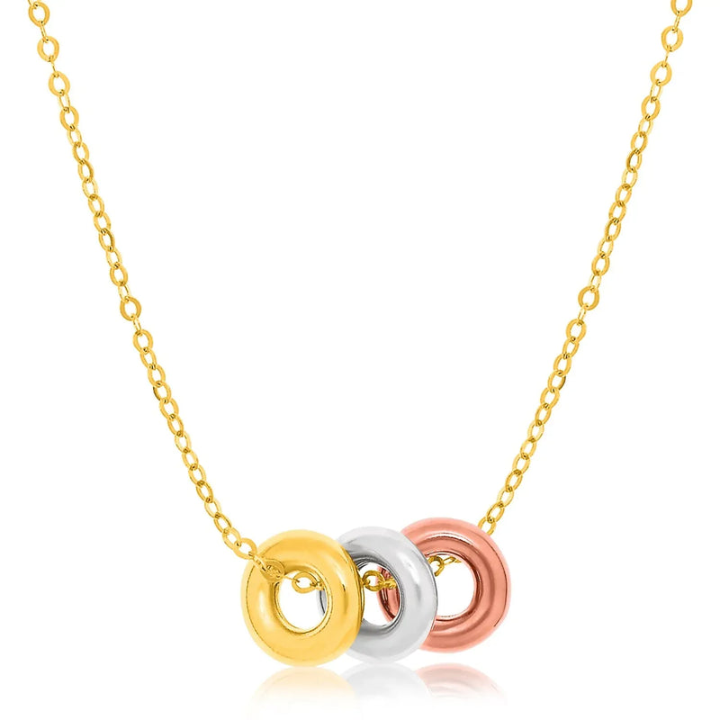 An image displaying 14k Tri-Color Gold Chain Necklace with Three Open Circle Accents by Orca Market