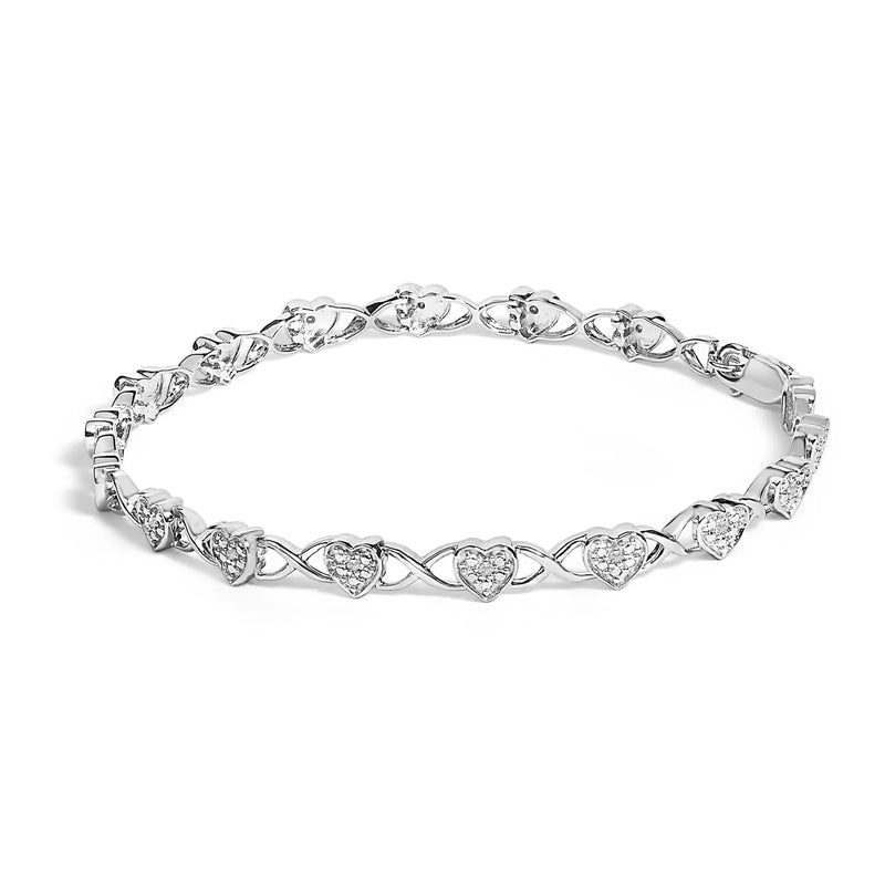 An image displaying .925 Sterling Silver Diamond Accent Heart Link Bracelet (I-J Color, I3 Clarity) - 7.25" by Infinite Jewels