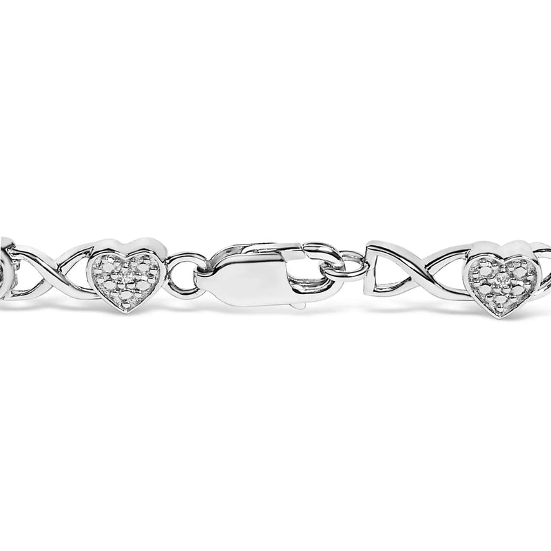 An image displaying .925 Sterling Silver Diamond Accent Heart Link Bracelet (I-J Color, I3 Clarity) - 7.25" by Infinite Jewels