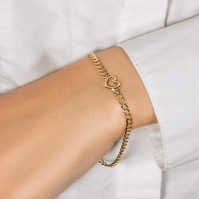 An image displaying 14k Yellow Gold 7 inch Curb Chain Bracelet with Heart by Orca Market