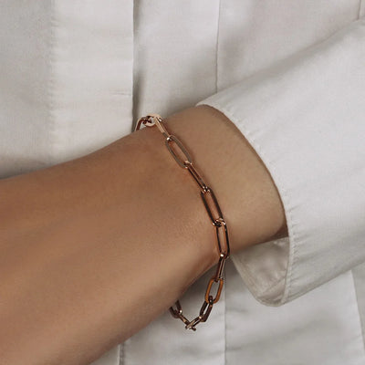 An image displaying 14K Rose Gold Bold Paperclip Chain Bracelet by Orca Market