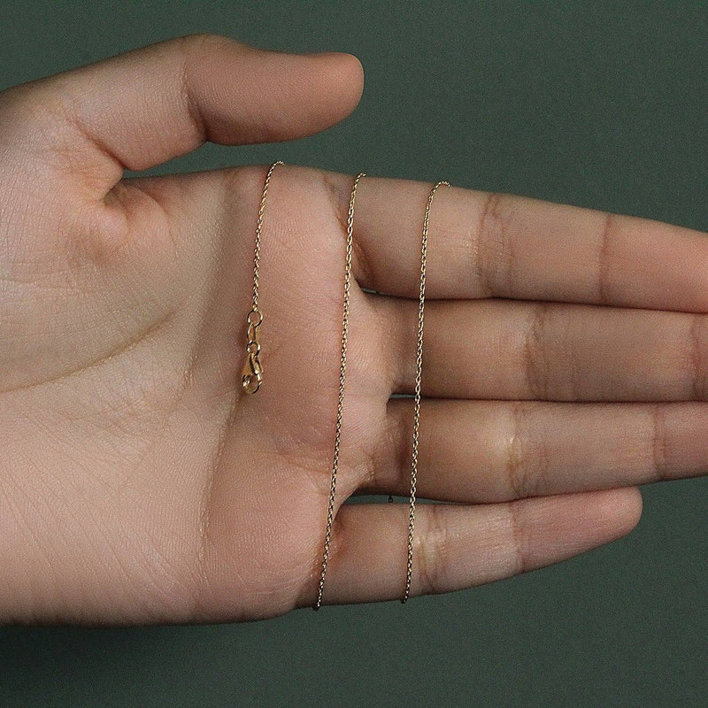 An image displaying 10k Yellow Gold Oval Cable Link Chain 0.97mm by Orca Market