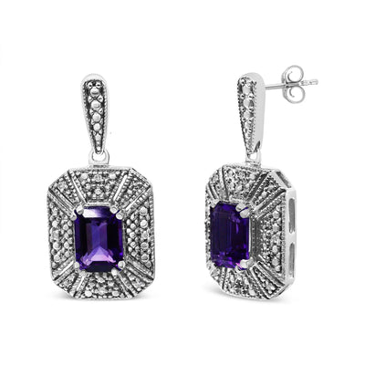 An image displaying .925 Sterling Silver Diamond Accent and 7x5mm Purple Amethyst Stud Earrings (I-J Color, I2-I3 Clarity) by Infinite Jewels