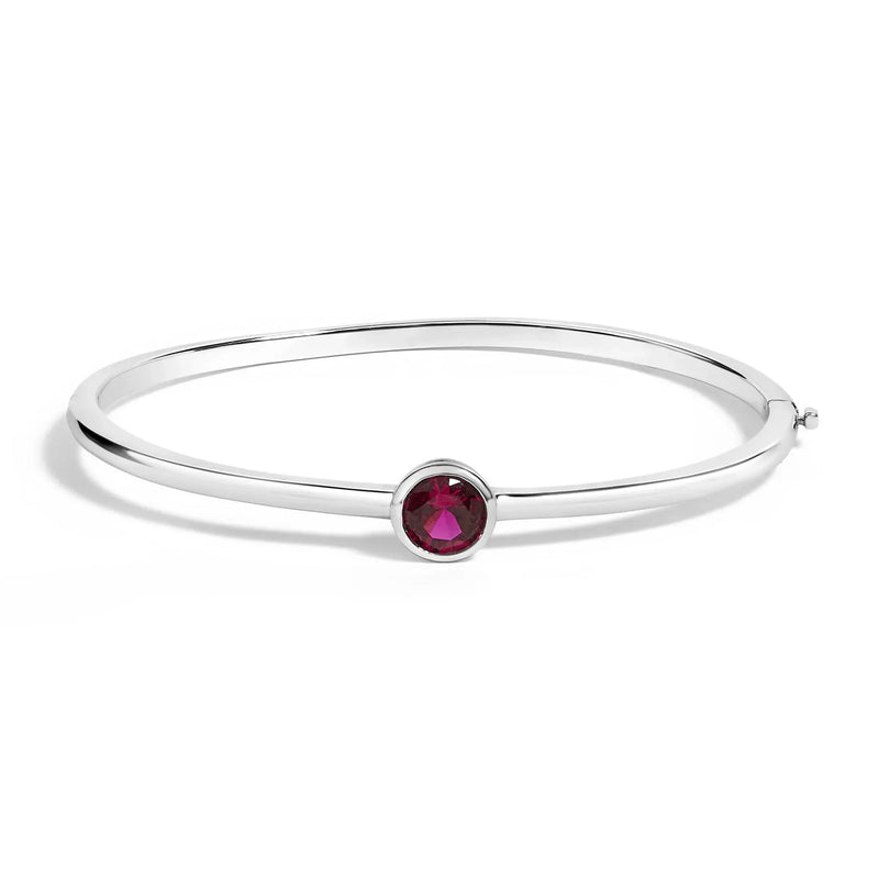 An image displaying .925 Sterling Silver 7X7MM Created Red Ruby Solitaire Bangle Bracelet - 7 Inches by Infinite Jewels