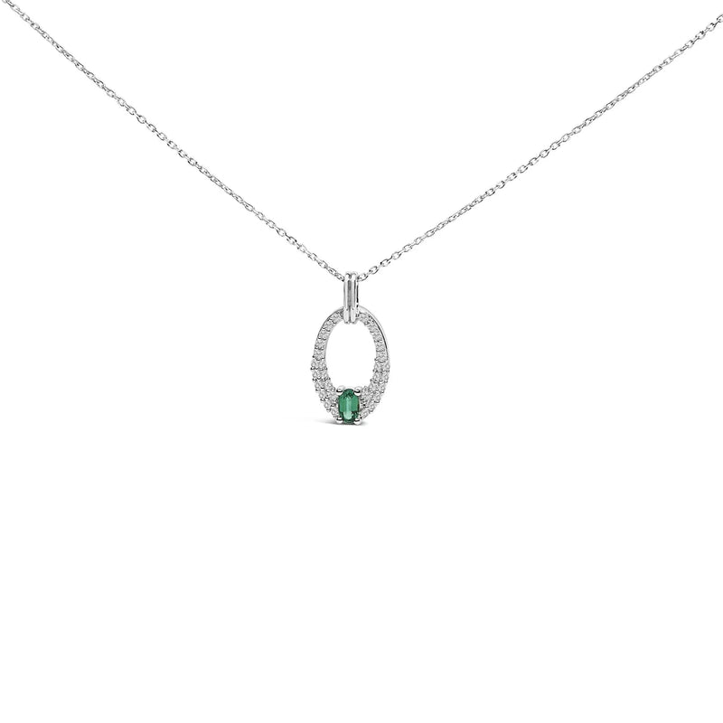 An image displaying .925 Sterling Silver Created Green Emerald and White Sapphire Oval Shaped Pendant Necklace - 18" Inches by Infinite Jewels