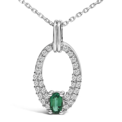An image displaying .925 Sterling Silver Created Green Emerald and White Sapphire Oval Shaped Pendant Necklace - 18" Inches by Infinite Jewels