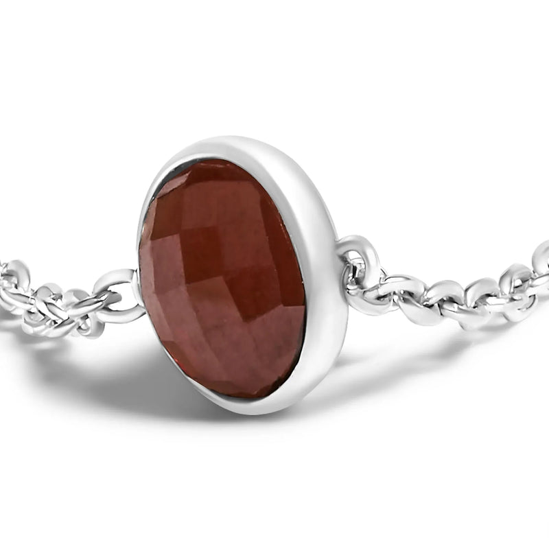 An image displaying .925 Sterling Silver Bezel Set Red Garnet 5 Station Adjustable Bolo Bracelet by Infinite Jewels
